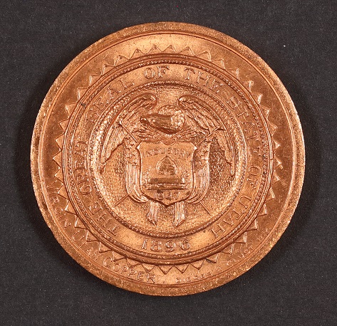 Back of a copper medallion from the Alaska-Pacific-Yukon Exposition.
