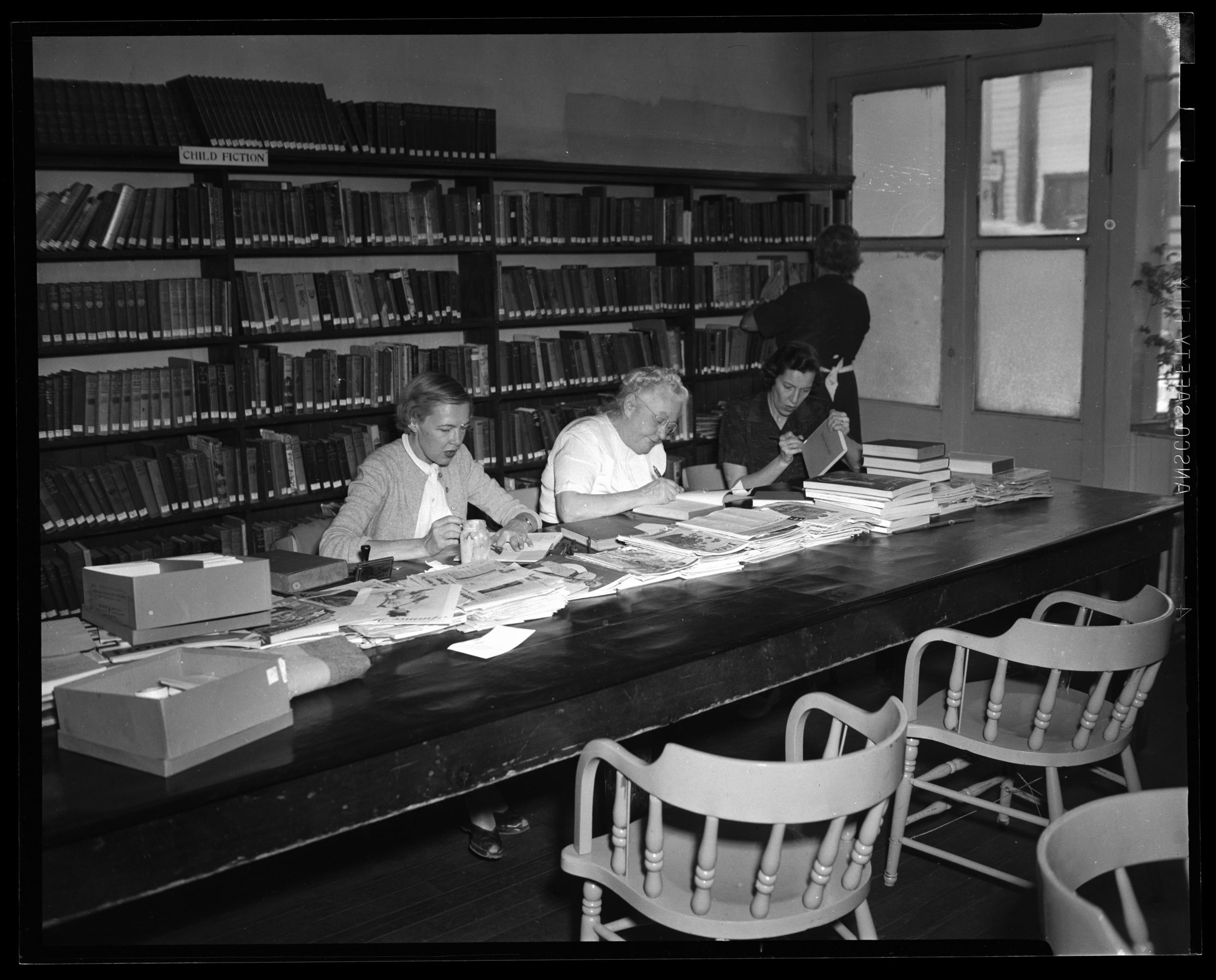 Athenaeum Workers at the Park City Public Library, October 1955 from the Park City Historical Society and Museum Kendall Webb Collection.