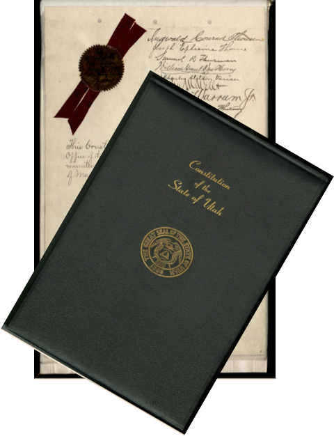 Black cover of Constitution of Utah over final page of constitution with seal and signatures.