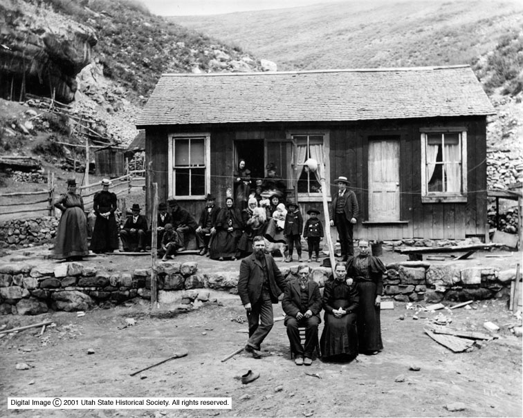 Image shows a group of Finlanders at the home of the Luoma brothers after a mine explosion.