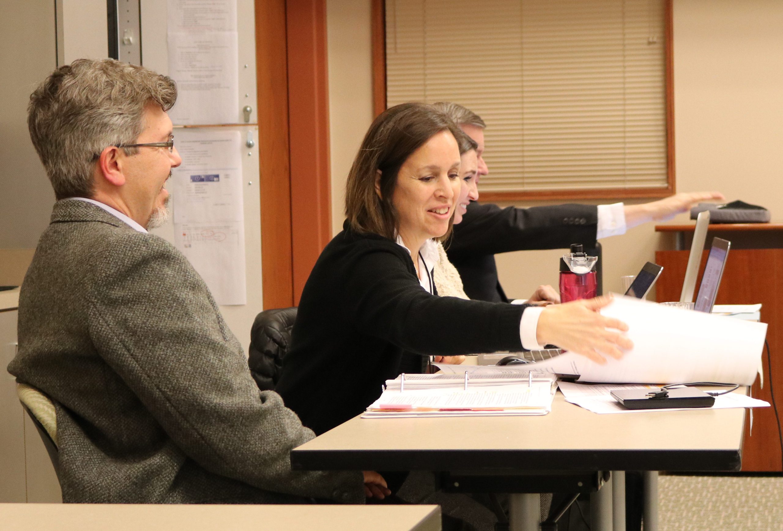 Dylan Mace, Nova Dubovik, Nicole Alder, and Paul Tonks sitting at secretary table during the February 8, 2018 State Records Committee meeting