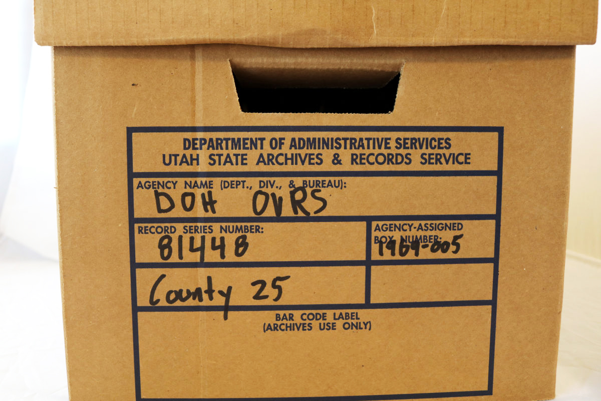 a box of files with DOH OVRS written on it