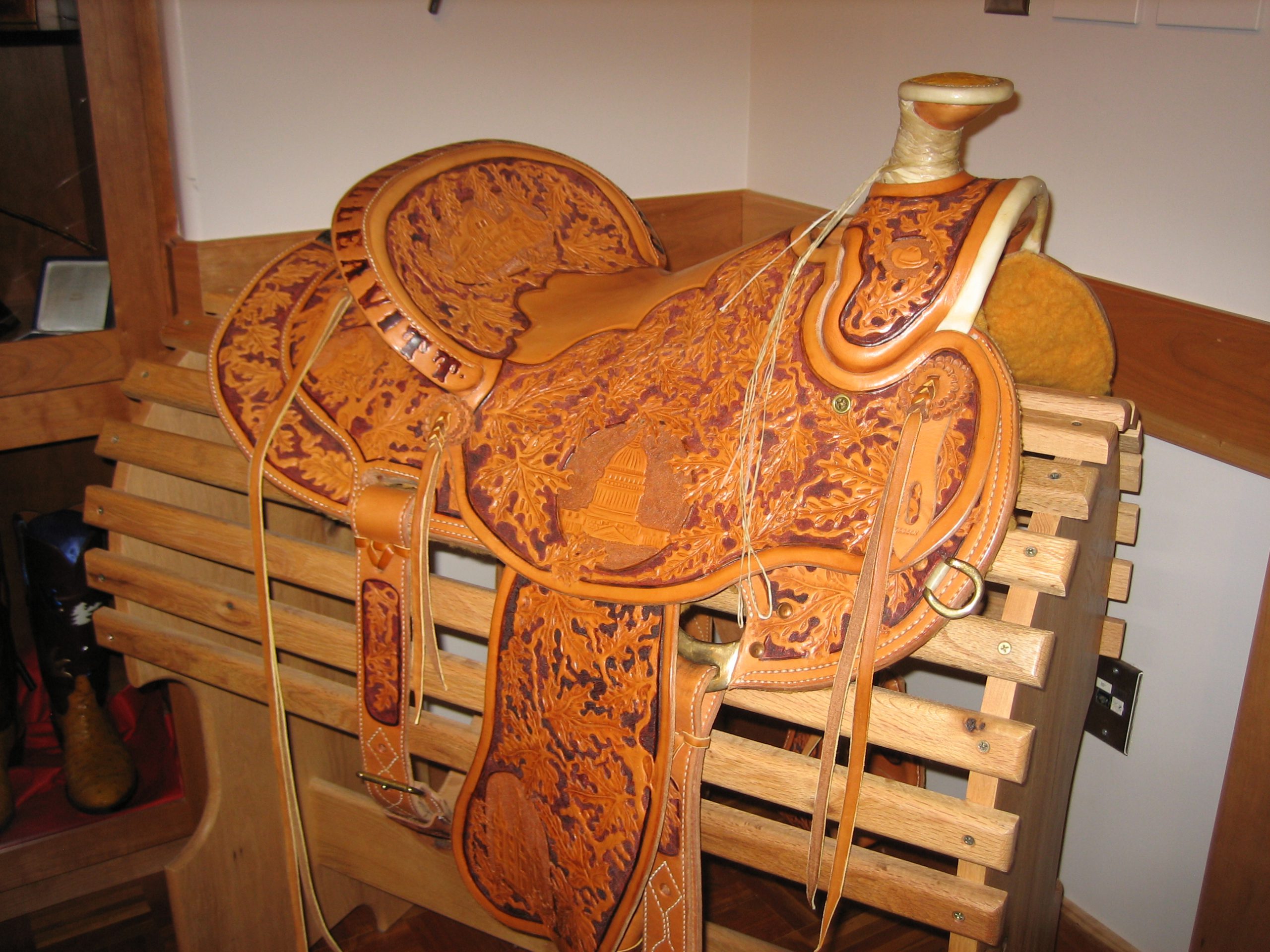 Clyde Price Saddle given to Governor Leavitt